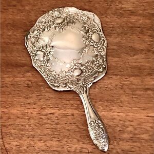 Vintage handheld mirror silver color